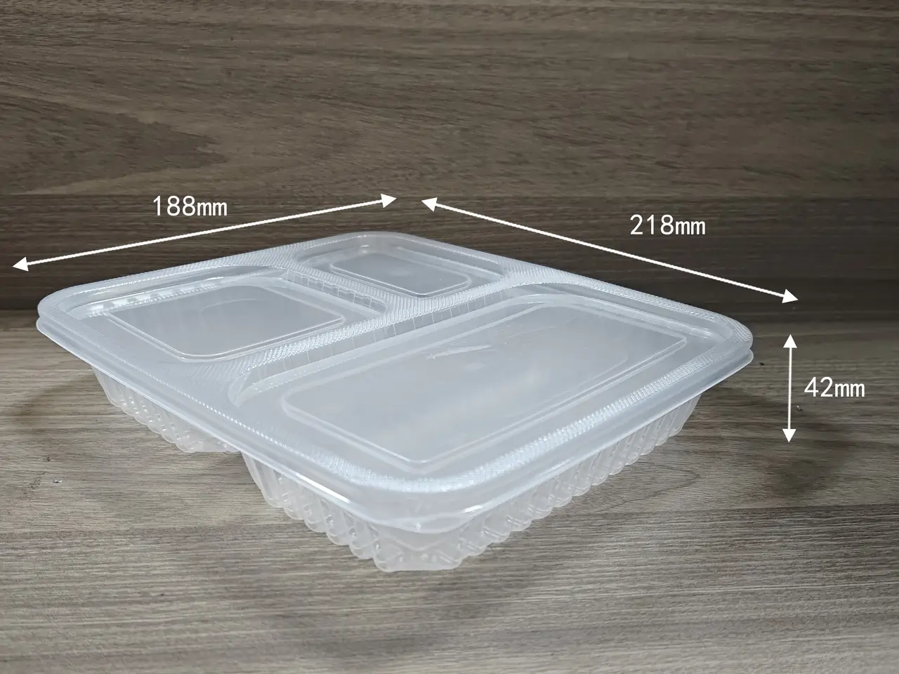 Divided fruit containers in clear PP with three, four and five compartments stacked at a partner plant